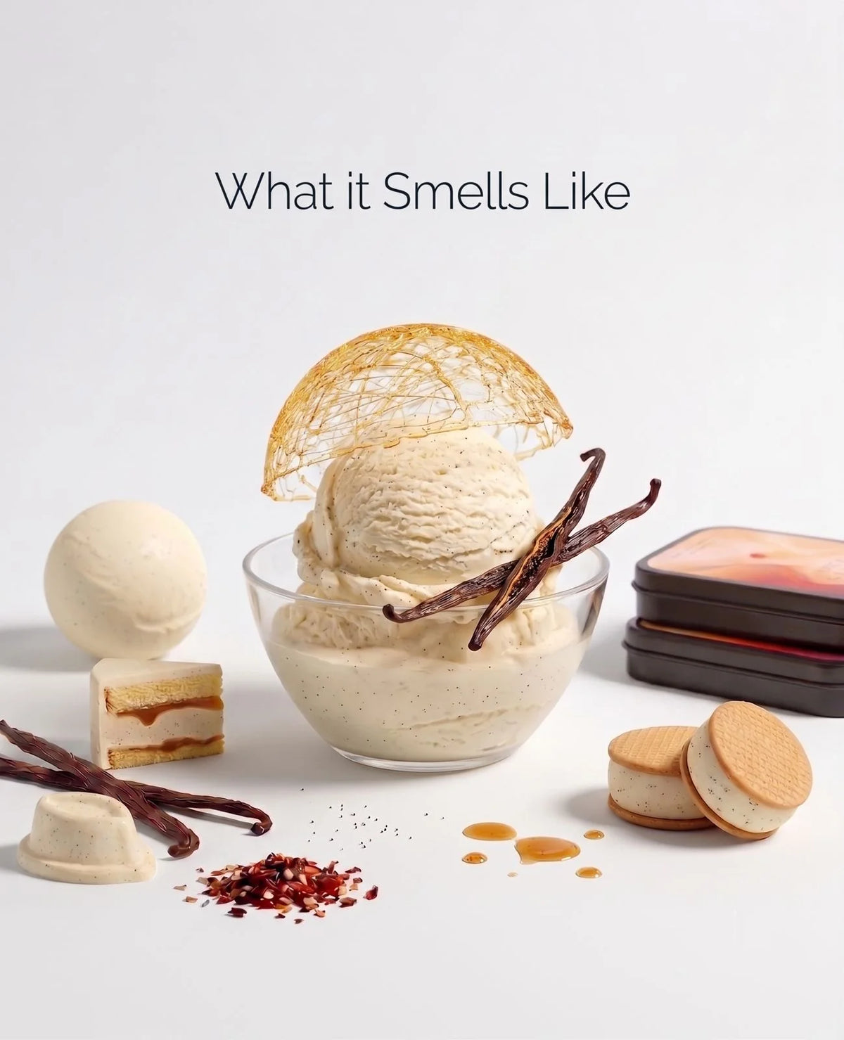 A dessert-inspired presentation on a clean white background with the text ‘What It Smells Like’ above. A glass bowl holds vanilla ice cream with a caramel swirl, topped with a golden lattice dome, vanilla beans, and chili flakes.